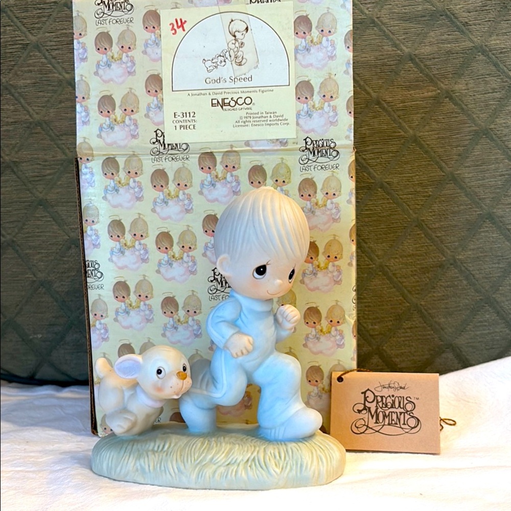 Enesco Precious Moments Figurine -Boy in Blue sweat suit with dog at his heels.